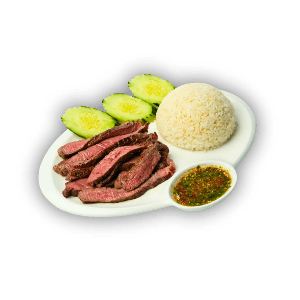 Crying tiger steak with white rice, cucumbers and Hmong pepper sauce